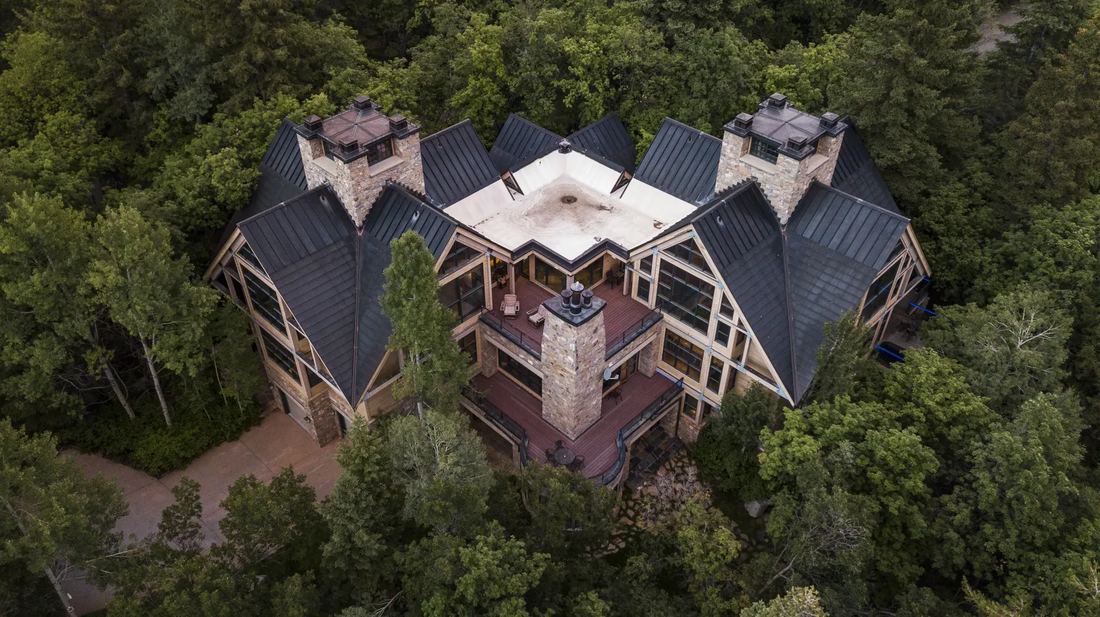 The lodge from above, surrounded by forest